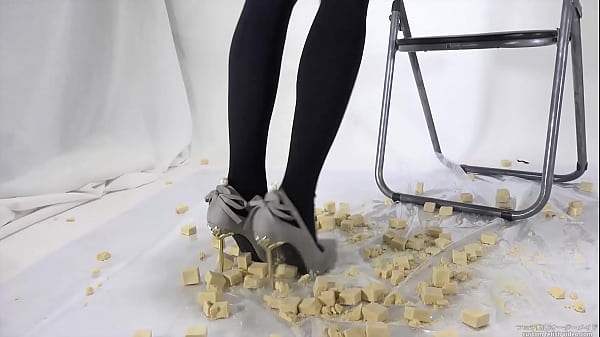 Beautiful legs woman slams food with legs 