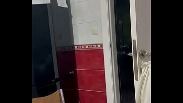 A Black man is tearing his T-shirt.