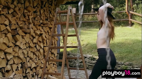 Skinny redhead russian babe Kate_Great stripping and chopping the firewood