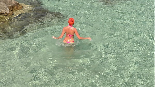 Pink bikini in a beautiful bay 
