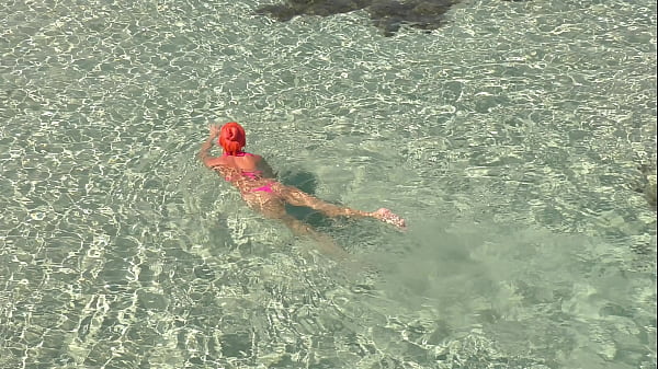 Pink bikini in a beautiful bay 
