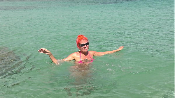 Pink bikini in a beautiful bay