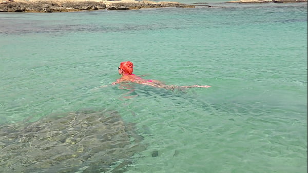 Pink bikini in a beautiful bay 