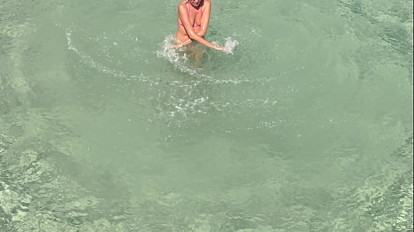 Pink bikini in a beautiful bay 
