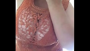 Attention craving whore rubs her pussy and shows off her massive tits in see through top