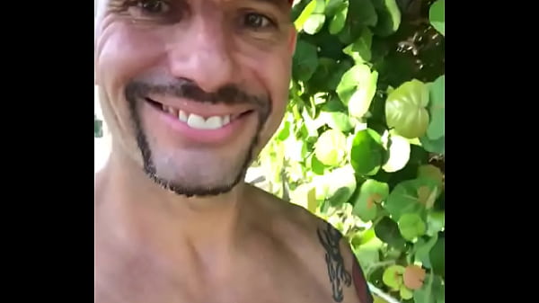 JUST A HAPPY GUY WALKING ON THE BEACH LIVING HIS BEST LIFE TAN FIT  LIFEGUARD PORNSTAR