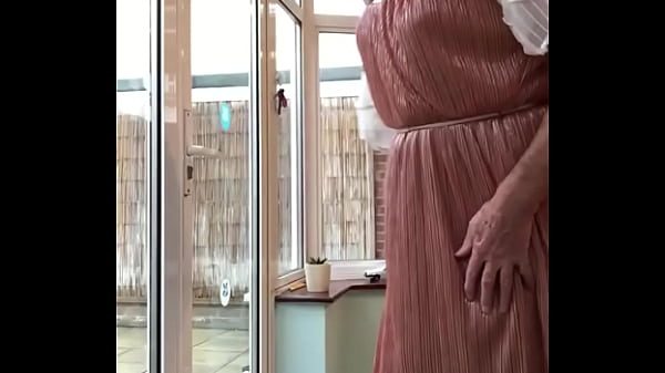 Pose in dress, and walk through door into garden 