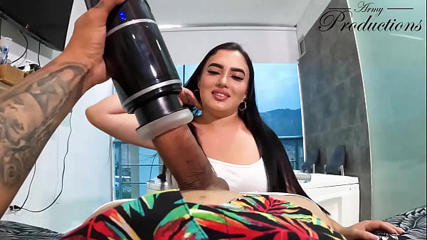 The cleaning girl helps him with his new toy by sucking him