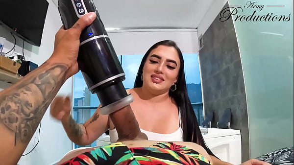 The cleaning girl helps him with his new toy by sucking him