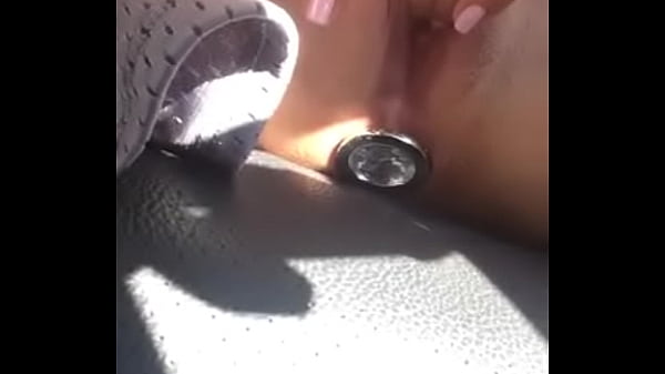 hot babe_masturbating in_her car_with a buttplug_in her ass