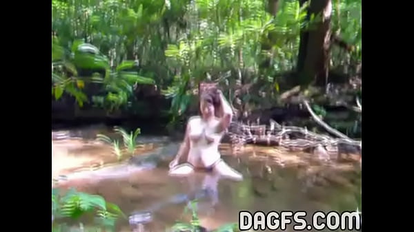 Fatty_lesbian_strumpetplays in water_outdoor_in the woods