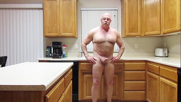 Naked onfoot inthe kitchen