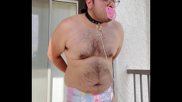 Diaper boy is tied up outside 