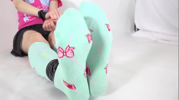 Restrained woman tickles sole