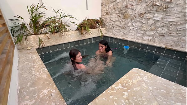 Two hot lesbians masturbate in a public pool afraid of getting caught