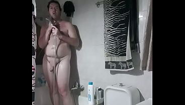 Nude boy in bathroom