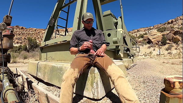 Pissing Tan Jeans On An Oil Pad thumbnail