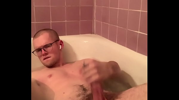 Jock enjoying himself in a bathtub 