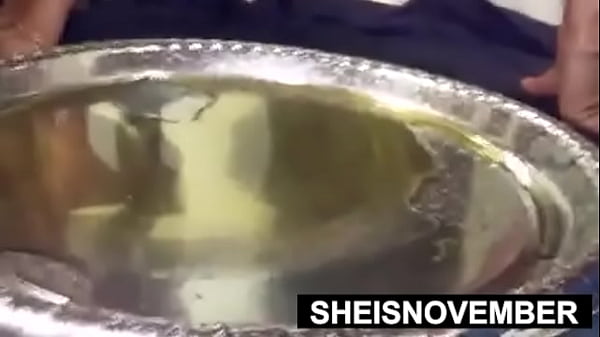 Chubby black hottie msnovember squatting and covered in oil with saggy titties and nipples exposed while pee peeing on sheisnovember