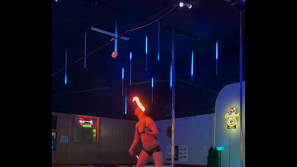 Destiny mae dancing and playing with fire on stage at the strip club
