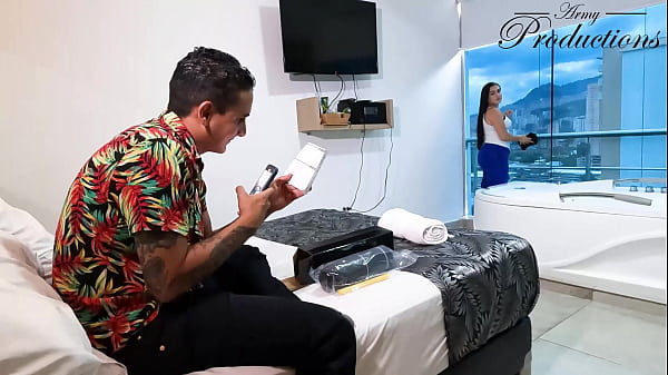 The cleaning girl helps him with his new toy by sucking him