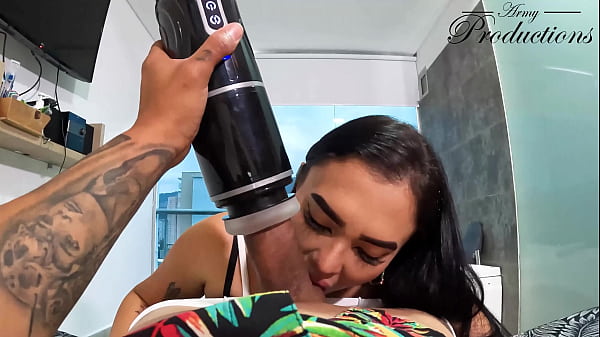 The cleaning girl helps him with his new toy by sucking him