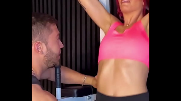 Coach brian evansx teaches his student yenifer chacon how to hold the bar 