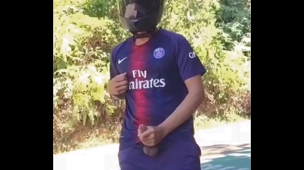 Biker Football player uniform jerking off out in public