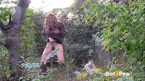See This Sexy Redhead Pull Down Her Pants And Let Loose A Huge Spray Of Piss In The Woods, Wiping Herself With Her Fingers And Then Shaking Her Drips Off Afterwards! thumbnail