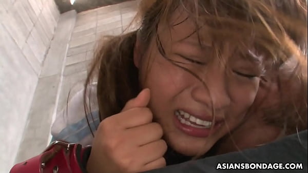 Wearing A Collar And A Leash, And Having Her Hands Restrained, This Asian Slut Can Do Nothing Against The Horny Dude That Got Behind Her And Started Fucking Her Hairy Twat With All His Might. thumbnail