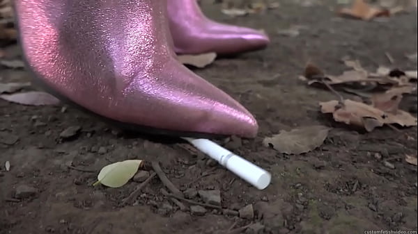 Crush by trampling a cigarette with long boots