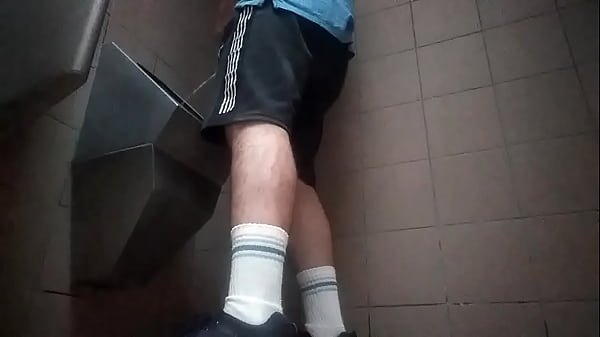 Gay guy peeing in socks and shorts 