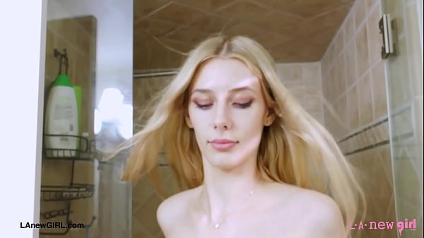 Aspiring blonde model enjoys a sensual bath 