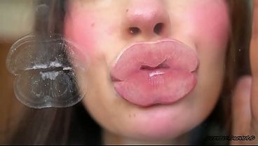 Pillow-soft Glossed Lips In A Melting Sensual Kiss thumbnail