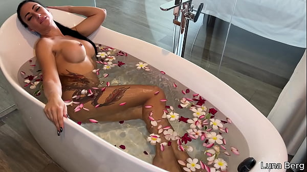 Bath of naked milf masturbates among flowers 