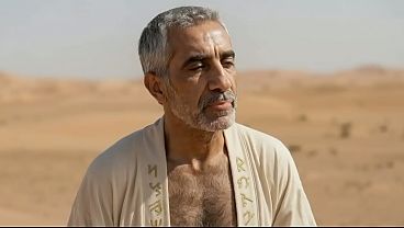 Ali, the old immortal mage gets his cock sucked in a desert by mature hairy man - AI Generated