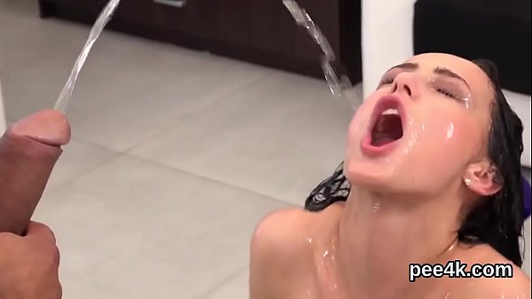 Intriguing nympho enjoys peeing cock and gets splashed with piss