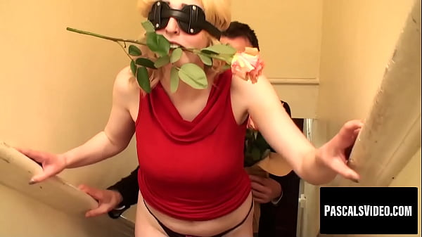 Busty submissive plays dual roles with flower and cock