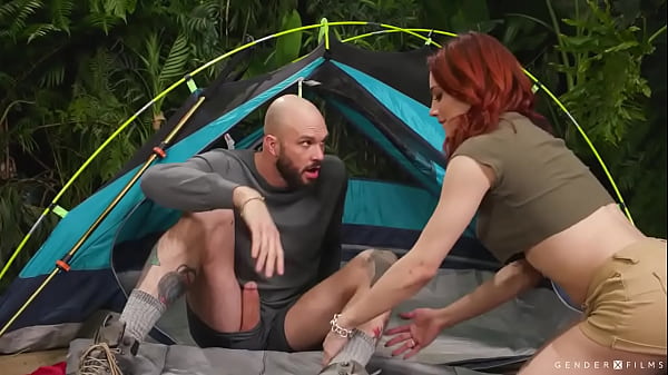 Big tits redhead TS Ariel Demure and her friend Cliff Jensen are kissing in their tent.After that,Ariel throats the big dick of Cliff passionately 