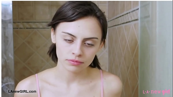 Attractive brunette model enjoys a sensual bath