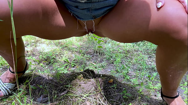 Pretty Woman Pissing In The Park Close-up thumbnail