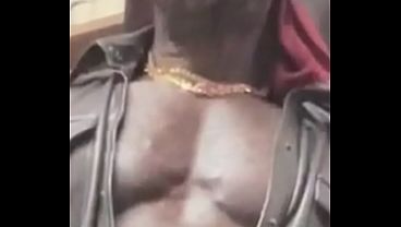 Ebony Bodybuilder Smokes Attired In A Variety Of Leather And Denim Based Outfits thumbnail