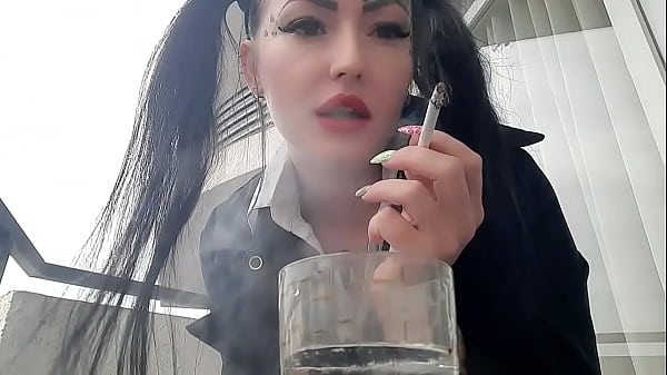 Smoking fetish Dominatrix Nika smokes sexy and spitsinto a_glass Imagine that this_glass isyour mouth and_you are_just an_ashtray_for Mistress