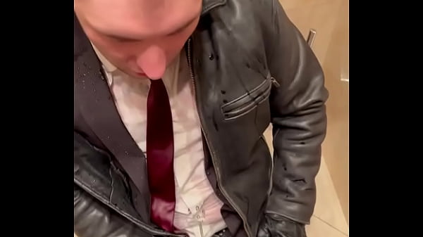Office boss in Suit pissing on office boy in suit and leather 