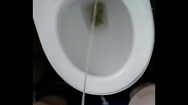 man pissing in toilet