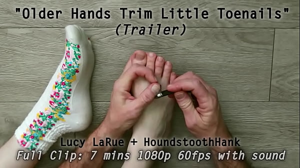 Older hands trim little toenails