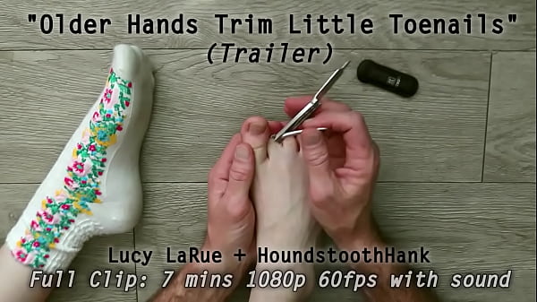 Older hands trim little toenails 