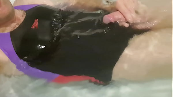 Man wearing a bathingsuit and spooging a load of sperm on it. 