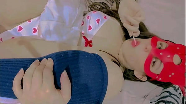 sucking lollipop lay down on the bed and masturbation 