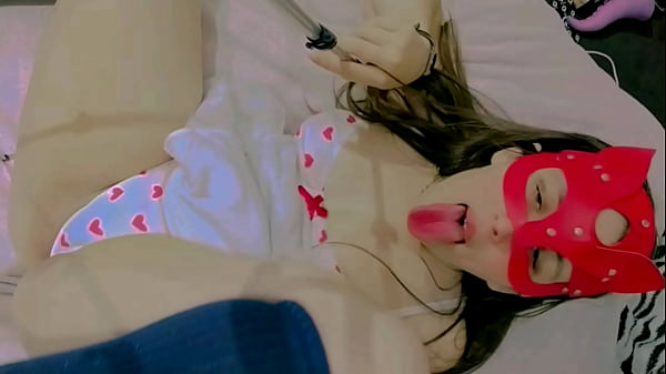 Sucking lollipop lay down on the bed and masturbation